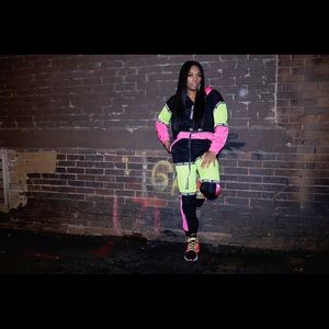 Multi color sweatsuit trimmed in pink and neon